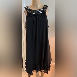Women’s black cocktail dress with ruffled bottom Size 12